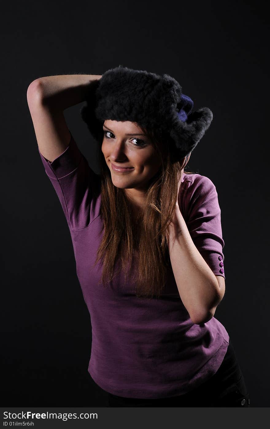 Woman in a fancy russian hat over black