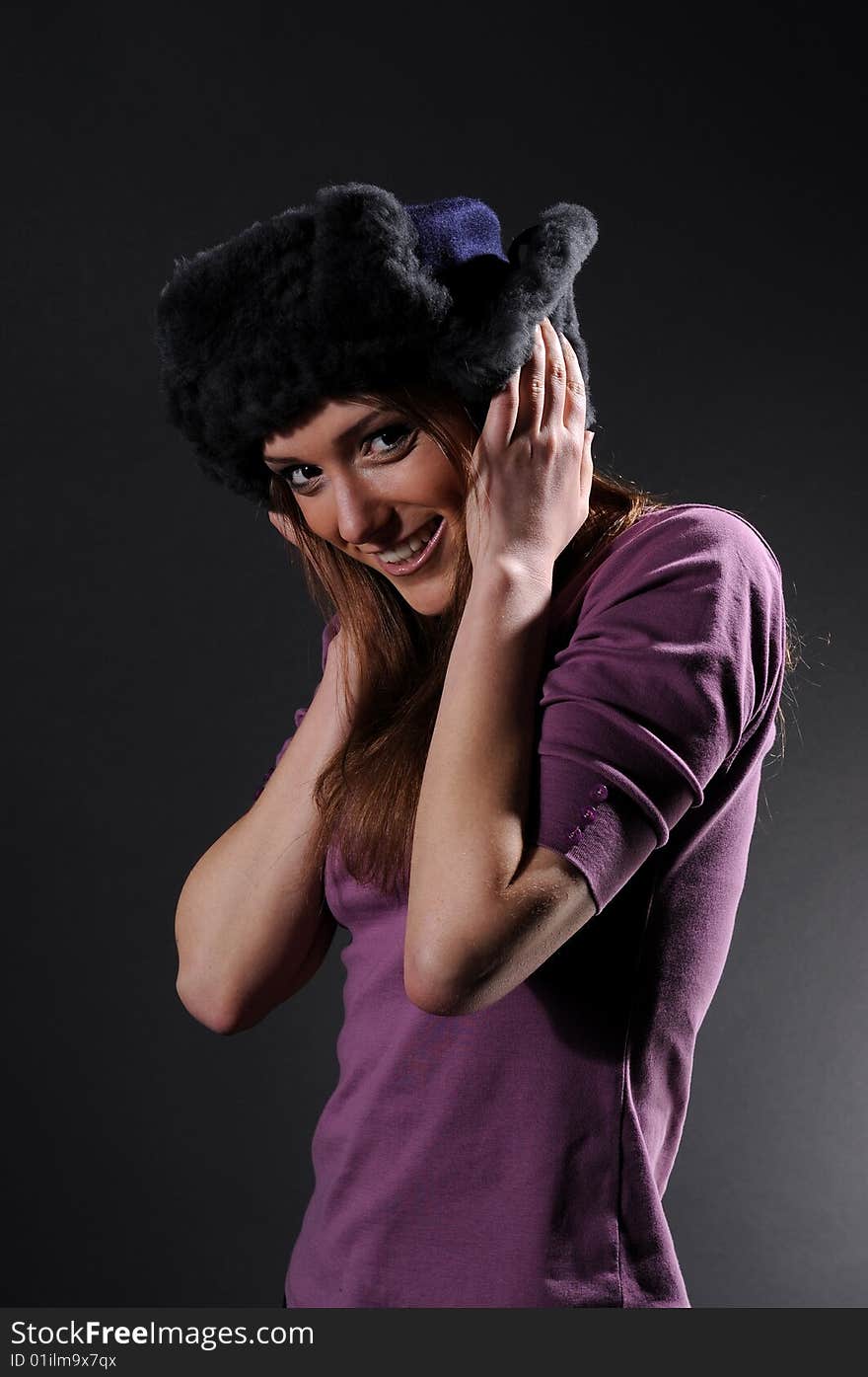 Woman in a fancy russian hat over black