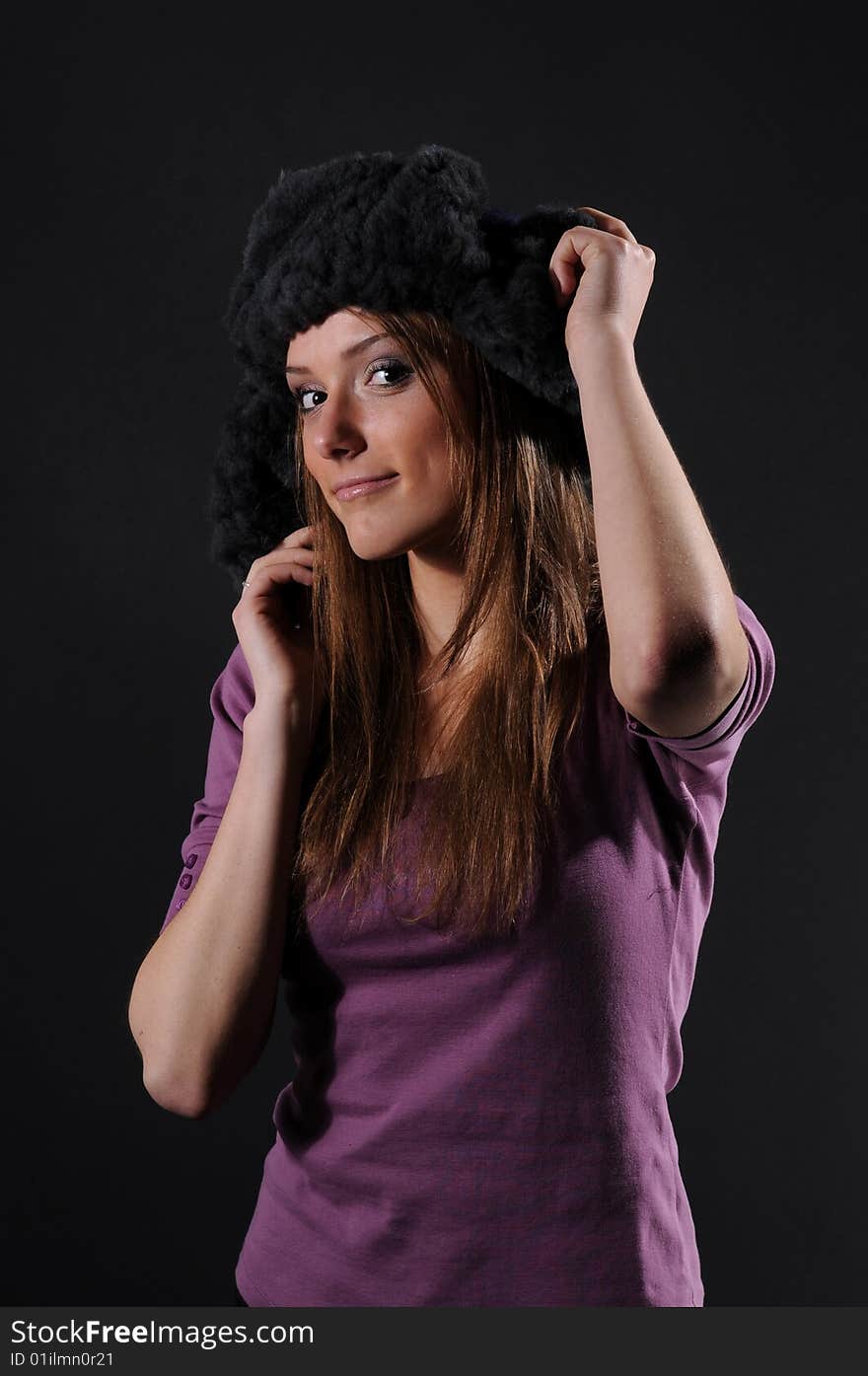 Woman in a fancy russian hat over black