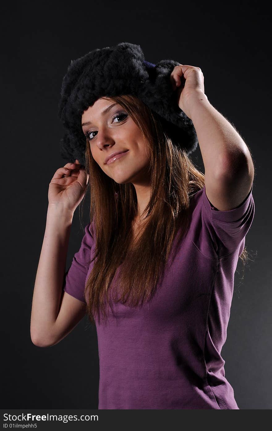 Woman in a fancy russian hat over black