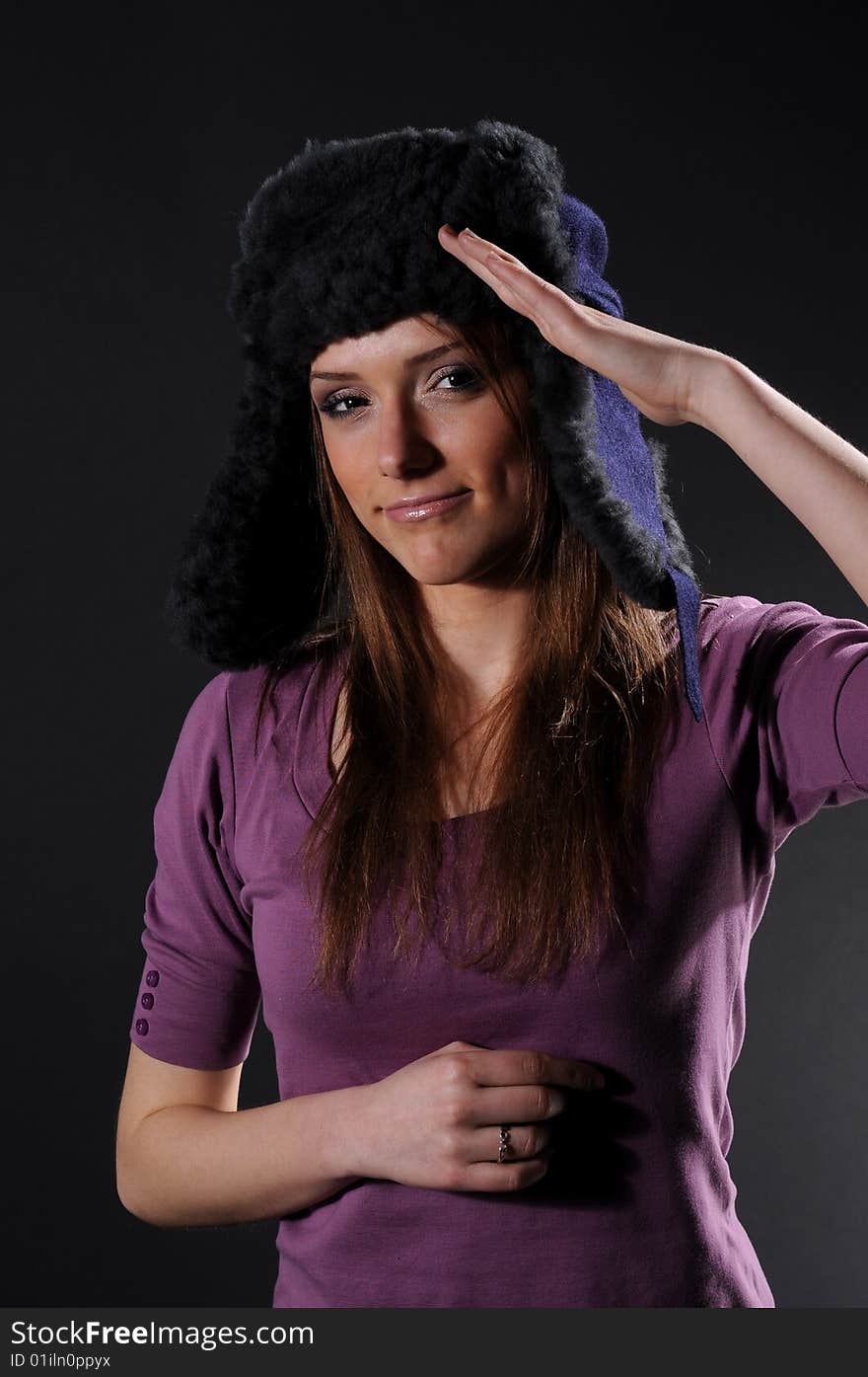 Woman in a fancy russian hat over black