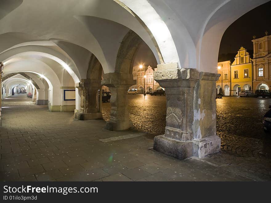 Arcade with town square in Litomysl at night lighting. UNESCO heritage.
