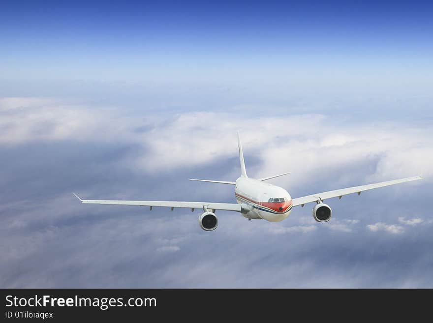 The airplane on  the blue sky background. The airplane on  the blue sky background.