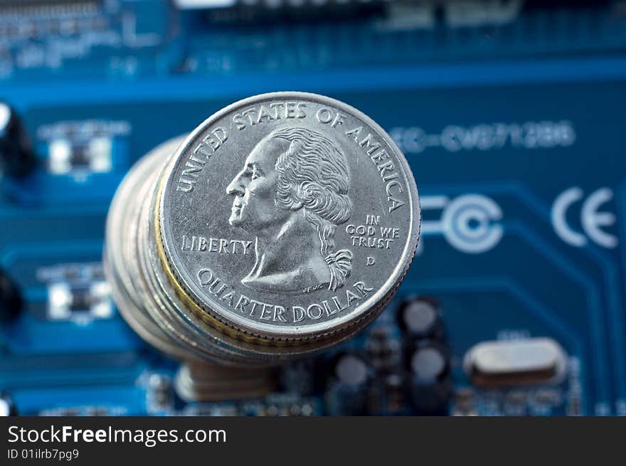 Make money on IT: quarter dollar coins over microcircuit