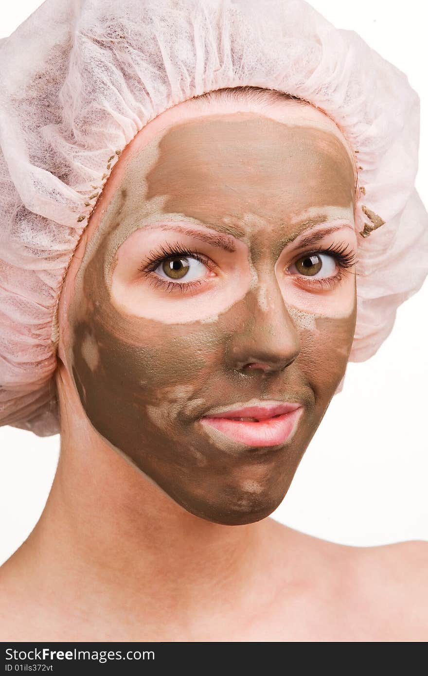 Young healthy woman with facial mask