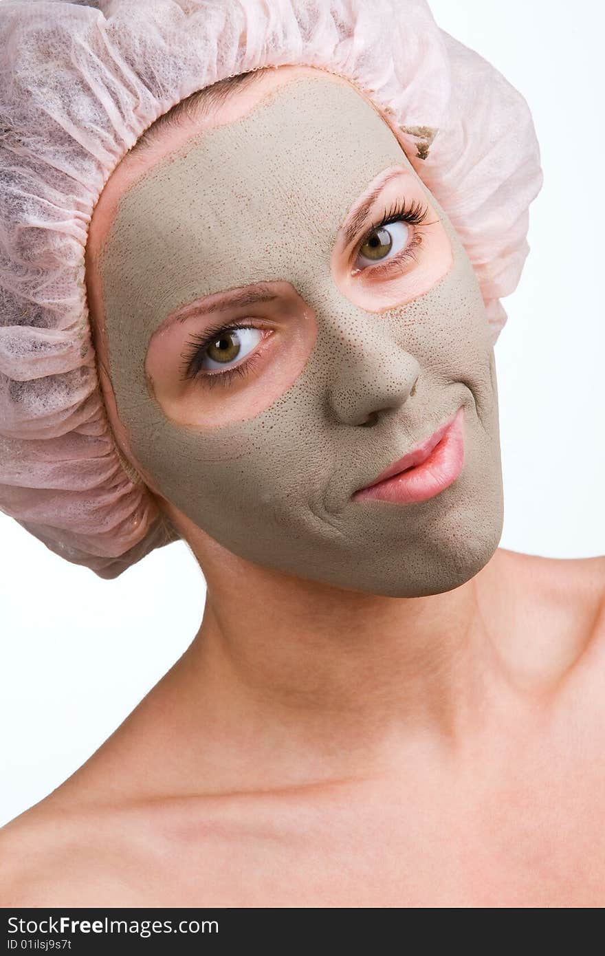 Young healthy woman with facial mask