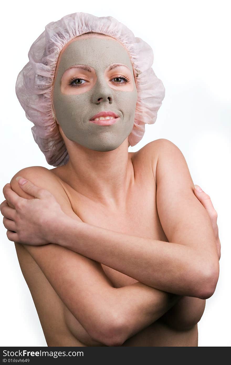 Young healthy woman with facial mask