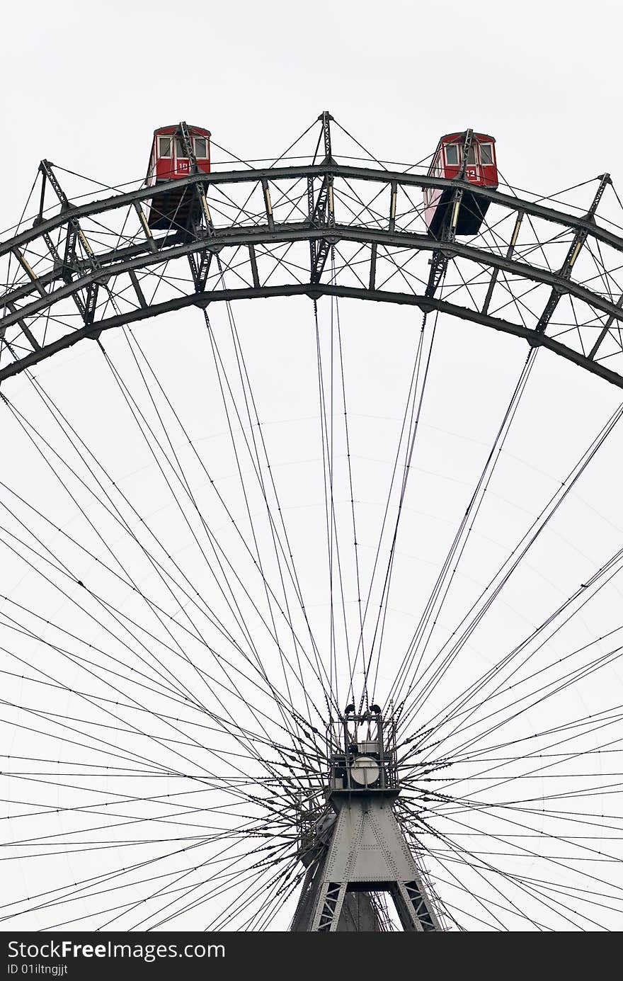 The viennese giant wheel is a ferris wheel in the famous austrian amusement park prater. it is about 60 meters high and was designed by walter basset. The viennese giant wheel is a ferris wheel in the famous austrian amusement park prater. it is about 60 meters high and was designed by walter basset