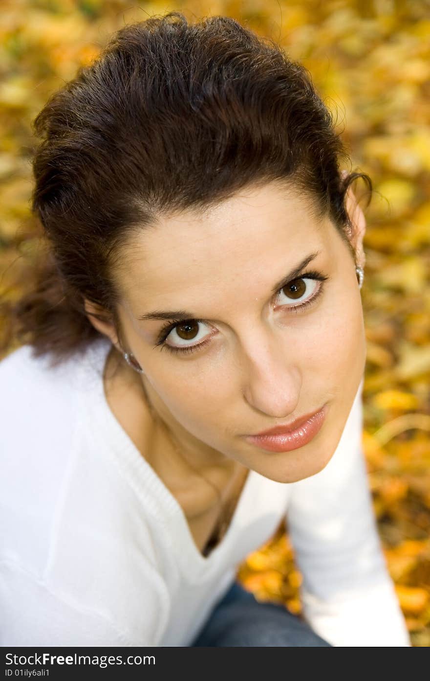 Portrait of pretty girl in autumn