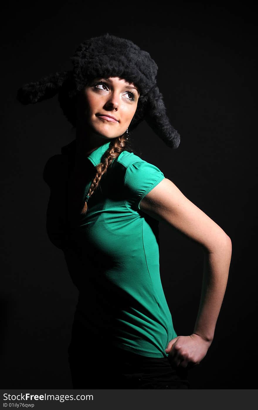 Woman in a fancy russian hat over black