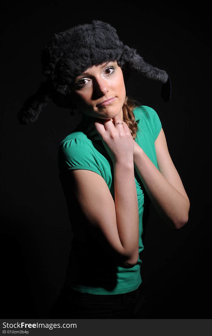 Woman in a fancy russian hat over black