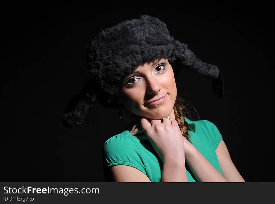 Woman in a fancy russian hat over black