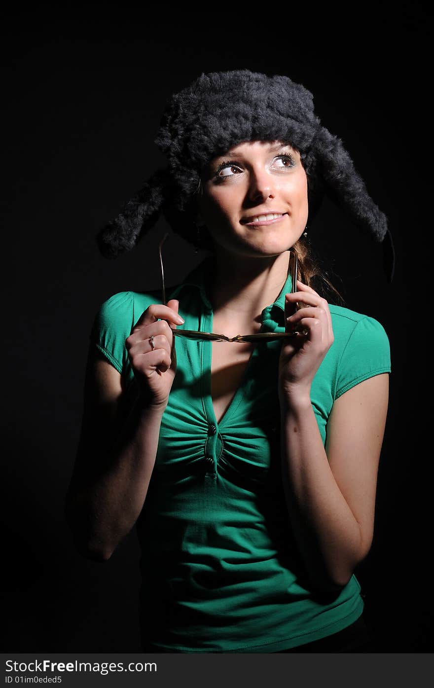 Woman in a fancy russian hat over black