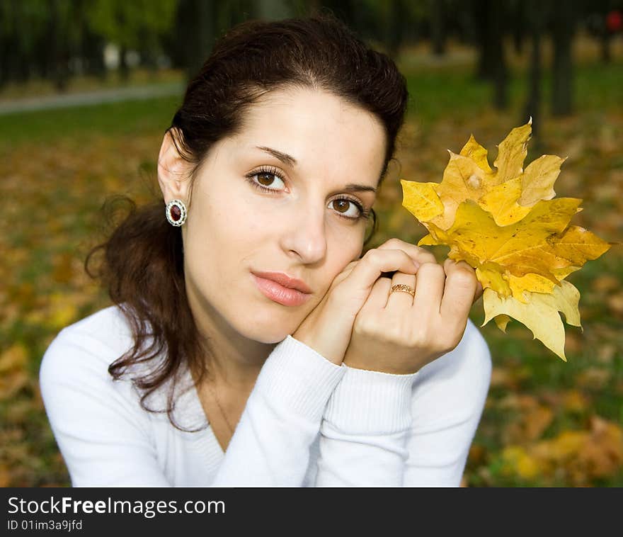 Portrait of cute girl with leaves