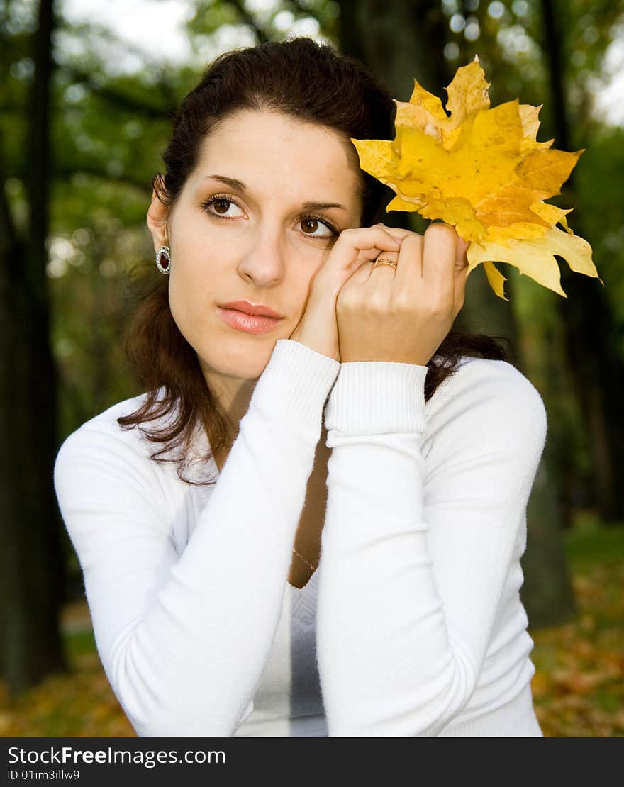 Portrait of cute girl with leaves