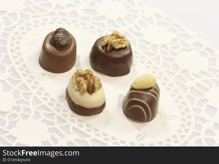 Four tasty chocolates with nuts