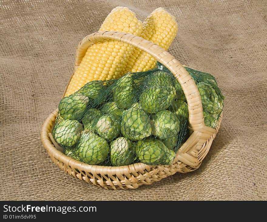 Brussels sprouts and maize-cob in a basket. Brussels sprouts and maize-cob in a basket