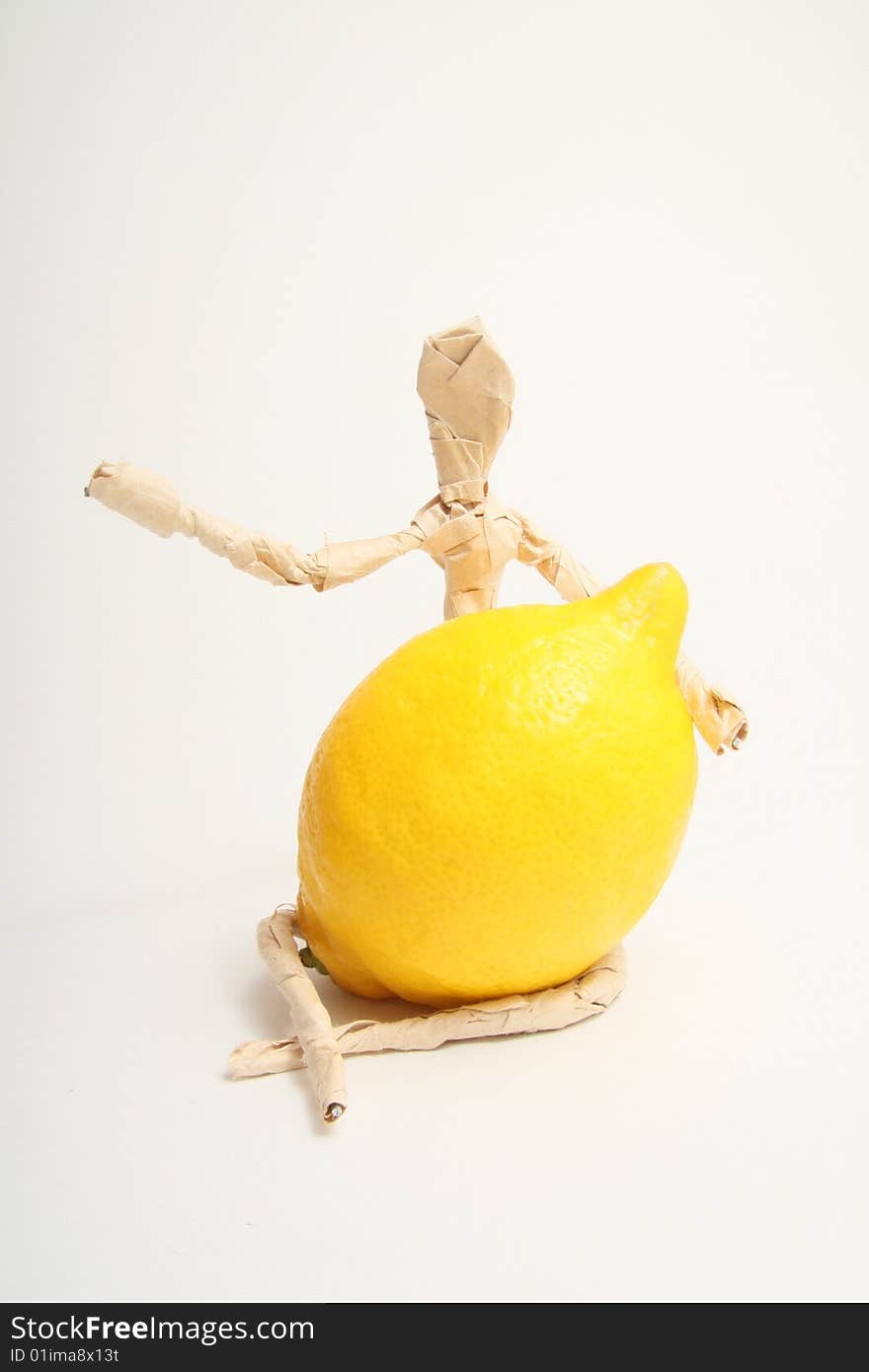 Figure of paper man with lemon. Figure of paper man with lemon