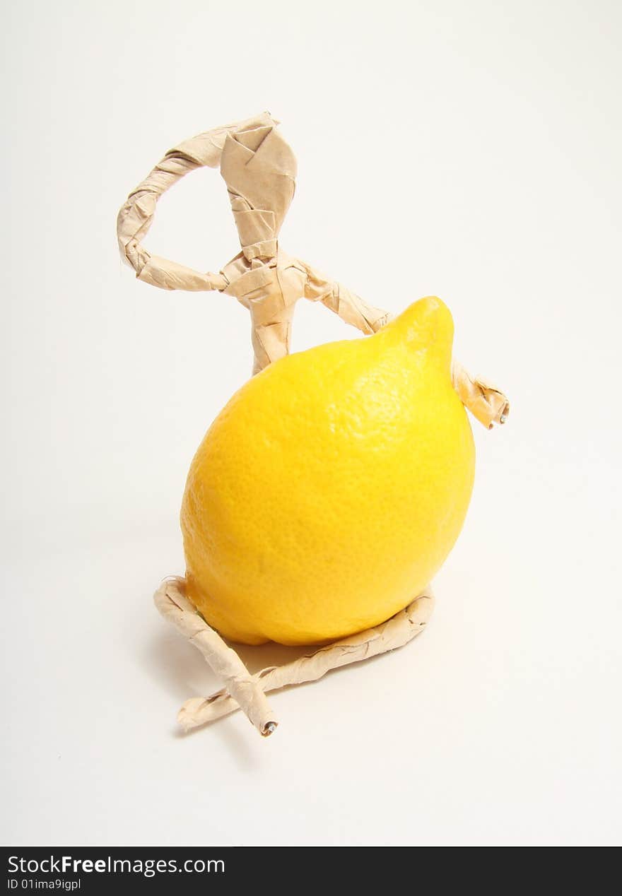 Figure of paper man with lemon. Figure of paper man with lemon