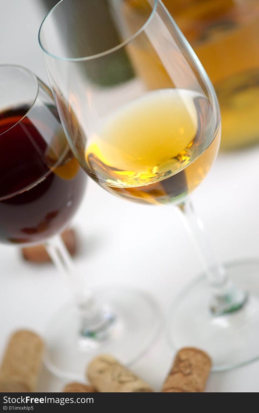 Glasses white and red wine on a white background