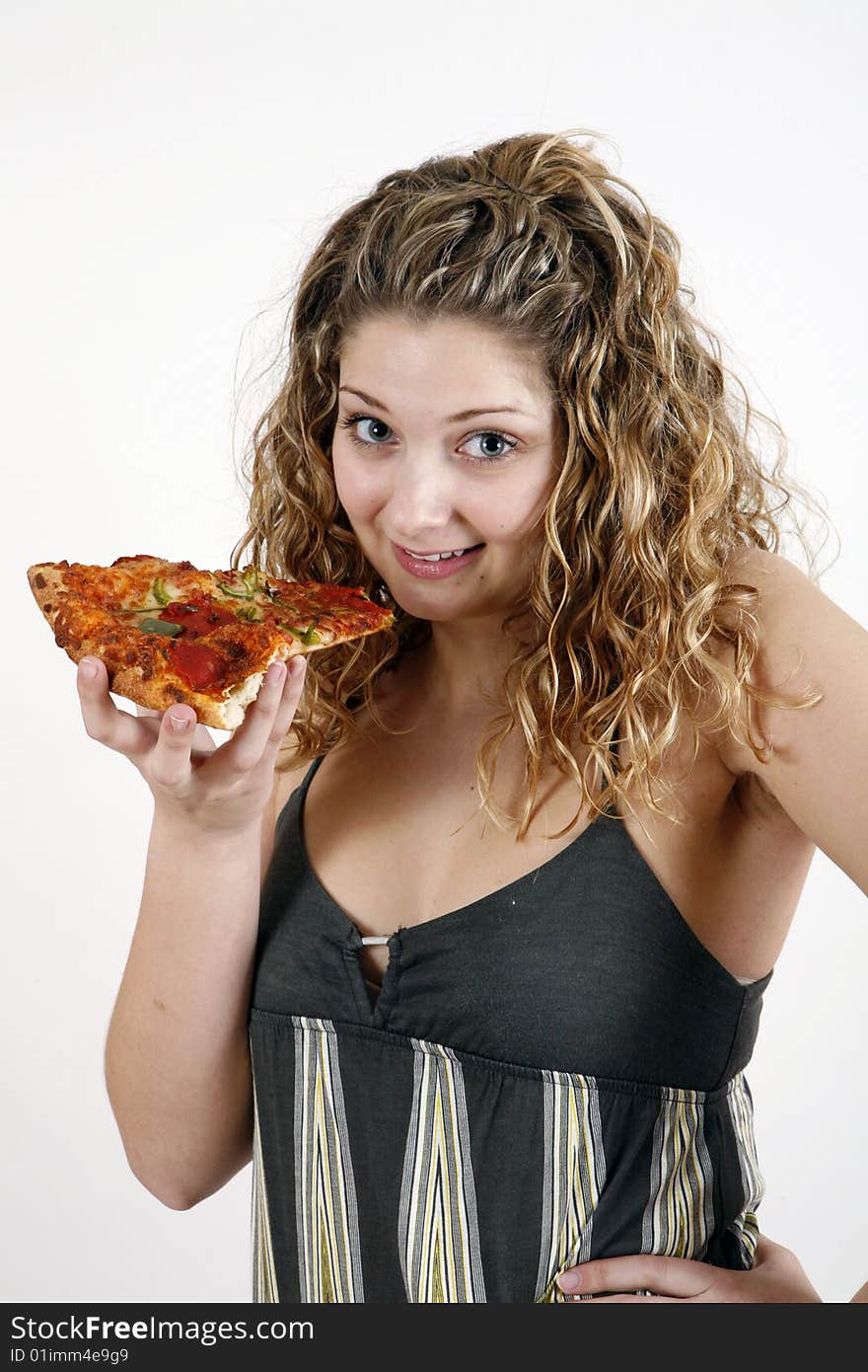 Girl eating pizza slice