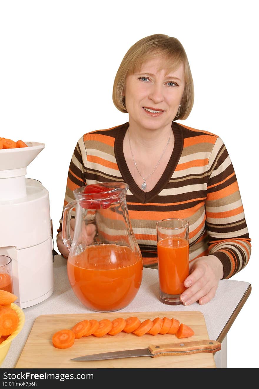 The woman has prepared for juice from carrots. The woman has prepared for juice from carrots