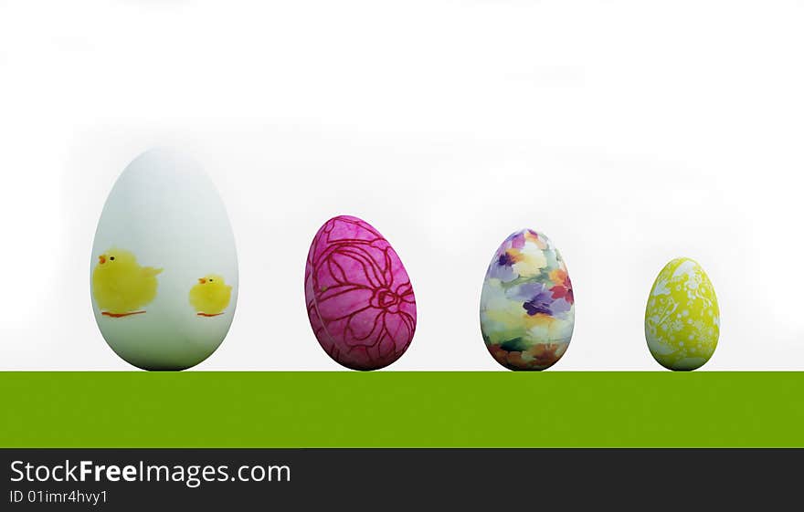 Four easter eggs on grass