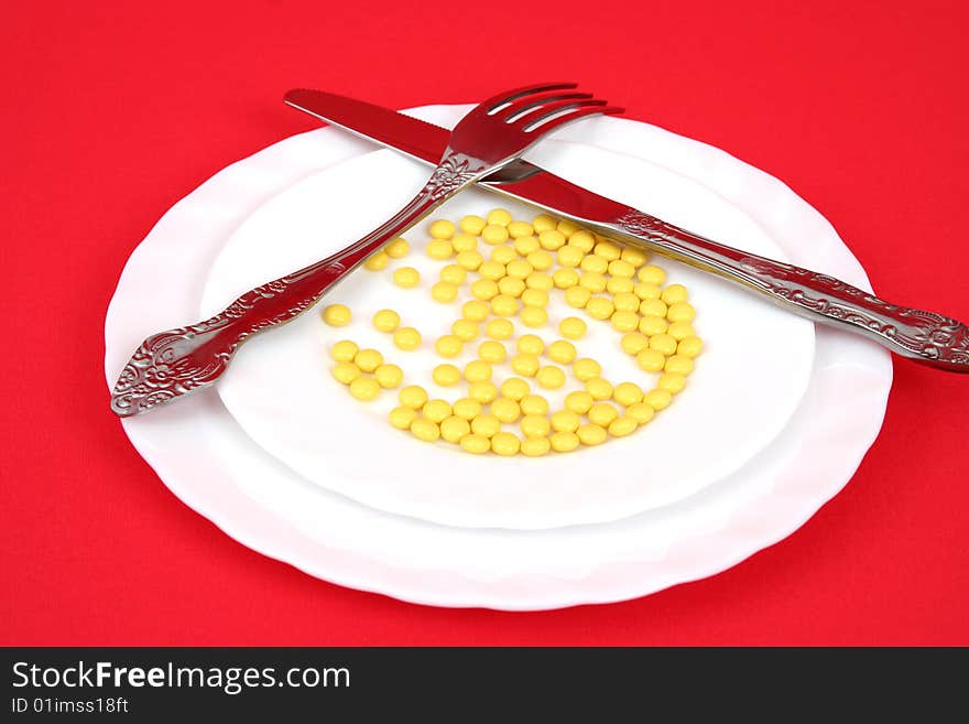 Plug, knife and tablets on a plate