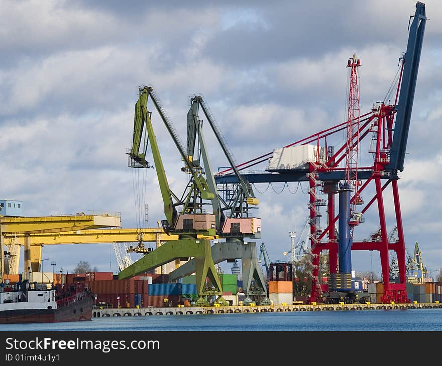 Gantry cranes and containers in a harbor. Gantry cranes and containers in a harbor