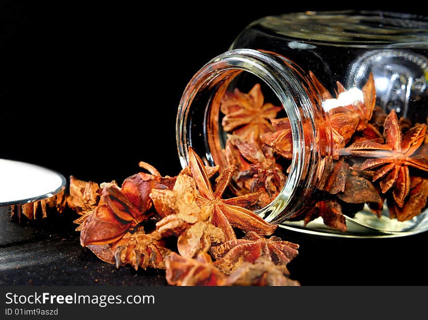 Anise Star in transparent container with black background. Anise Star in transparent container with black background