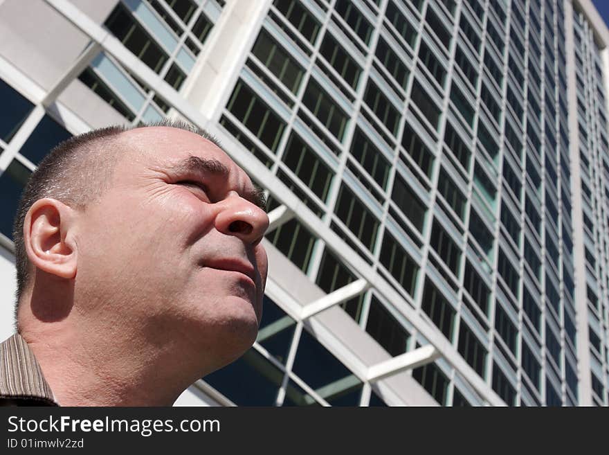 Portrait of a mature man on a skyscraper background