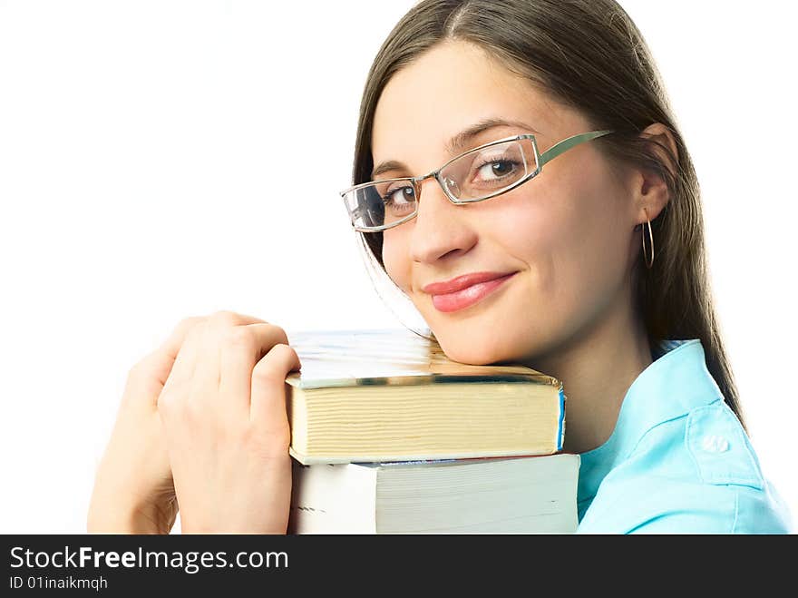 Happy young beautiful student holding books and looking at us with a smile. Happy young beautiful student holding books and looking at us with a smile