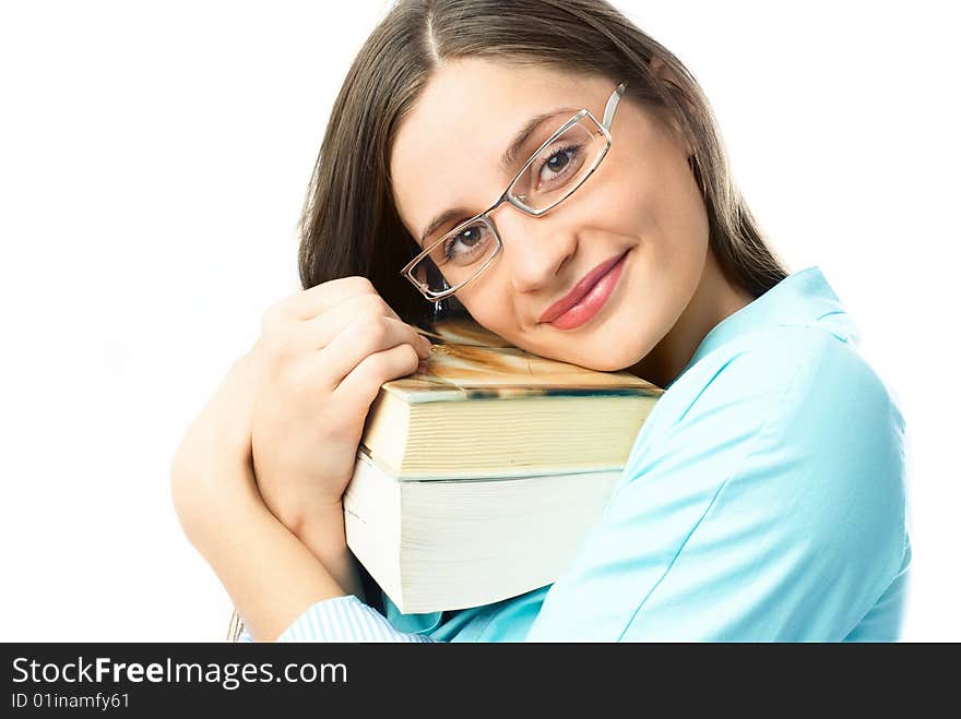 Happy young beautiful student holding many books and looking at us with a smile. Happy young beautiful student holding many books and looking at us with a smile