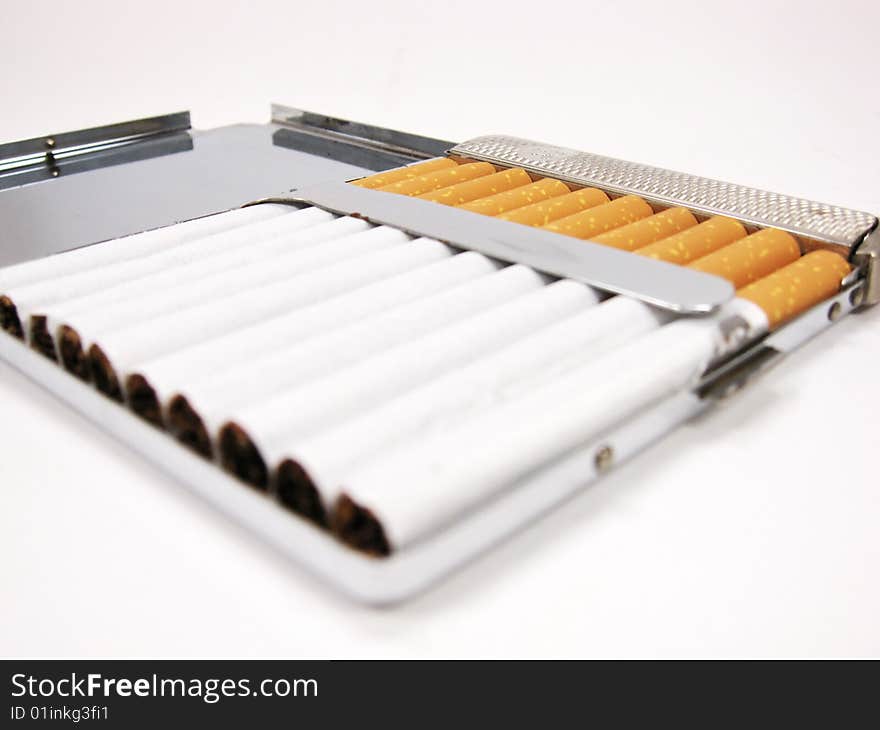 Cigarettes in metal case (close up)