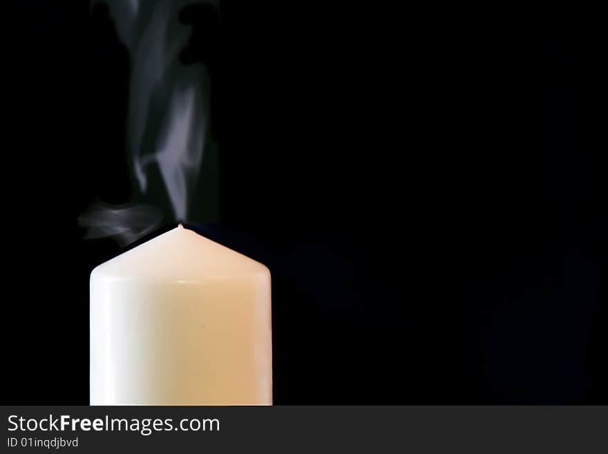 Candle isolated on black background