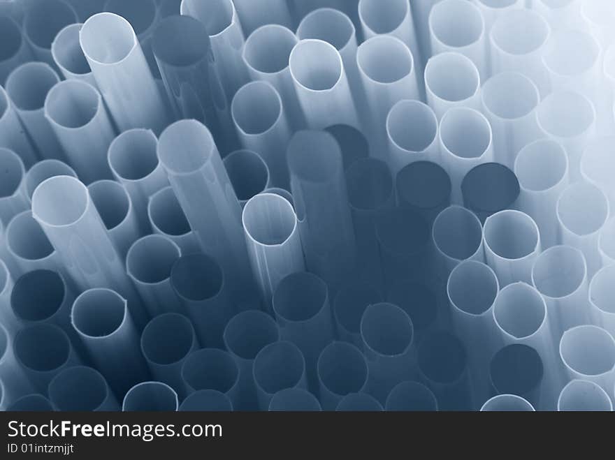 Blue toned abstract pattern of drinking straws. Blue toned abstract pattern of drinking straws