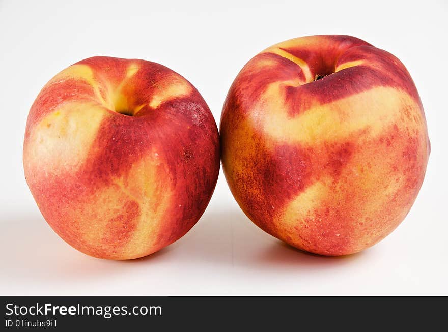 Pair of ripe yellow nectarines