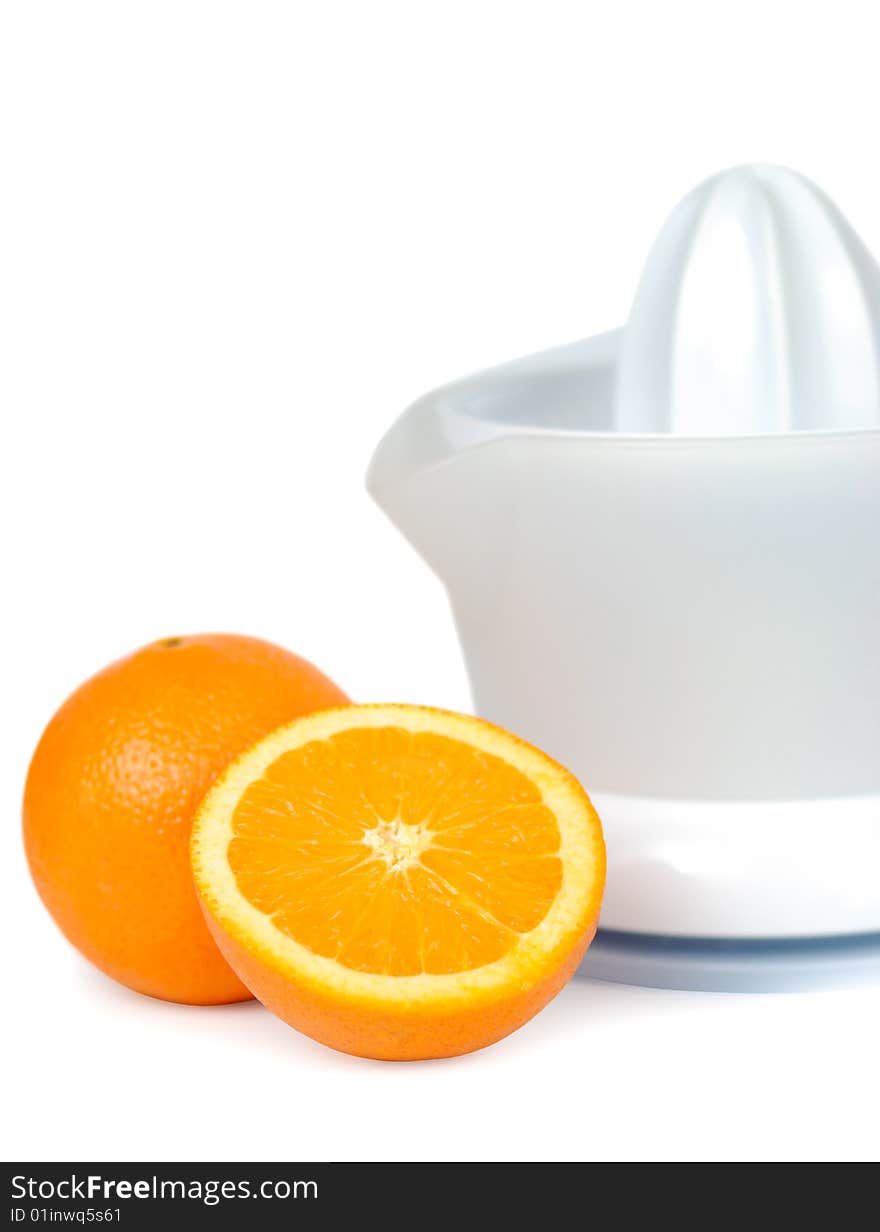 One and a half oranges with juicer isolated over white. One and a half oranges with juicer isolated over white