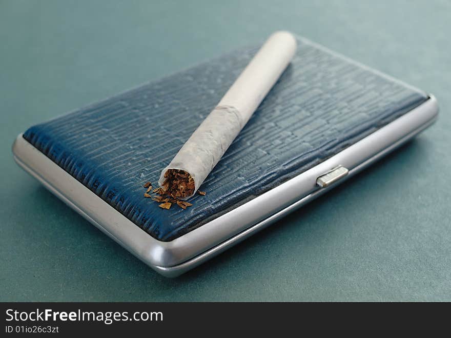 The russian cigarette lying on a leather cigarette-case