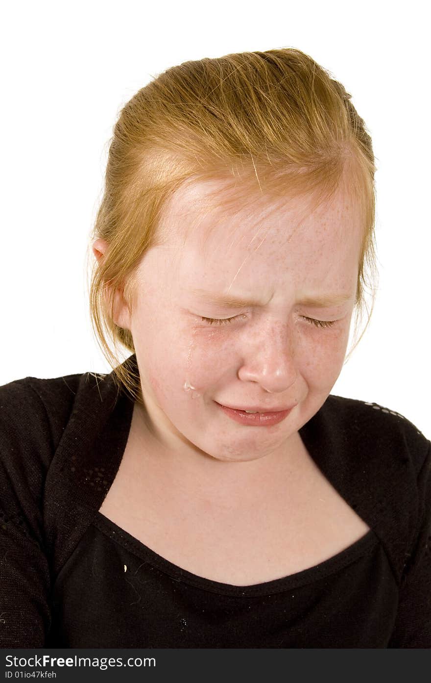 Little girl is crying on white