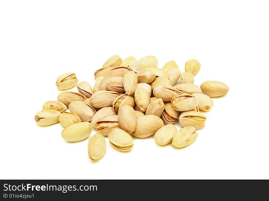 Pile of pistachio nuts isolated on white. Pile of pistachio nuts isolated on white.