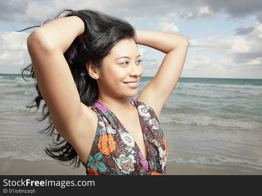 Beautiful woman by the shore