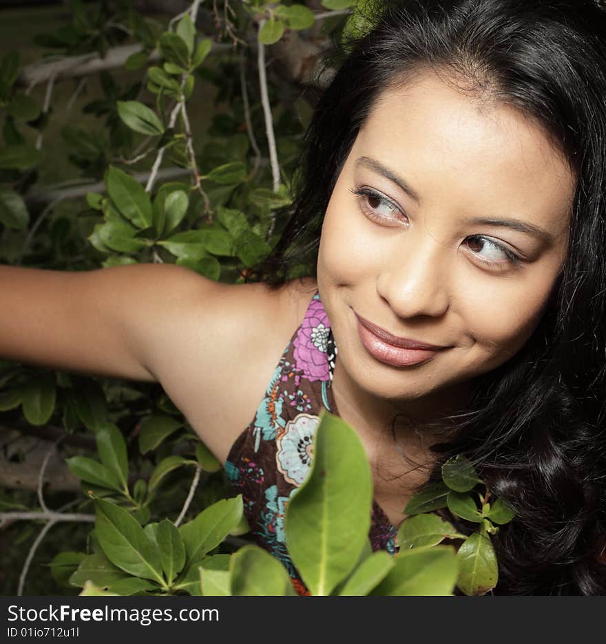 Headshot of a young brunette woman smiling. Headshot of a young brunette woman smiling