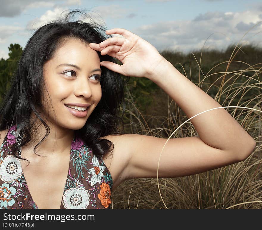 Young woman with her hand by her face. Young woman with her hand by her face