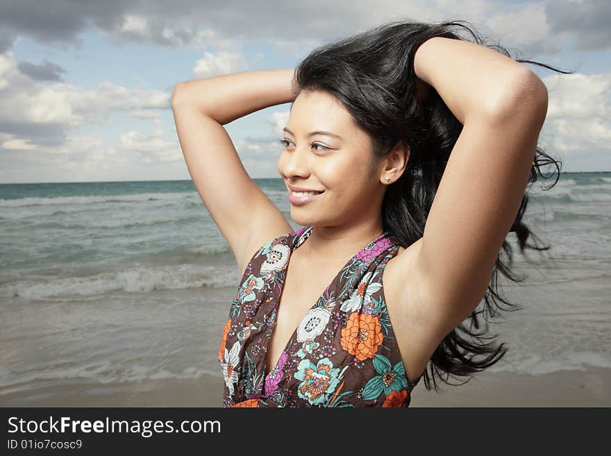 Beautiful young woman on the beach