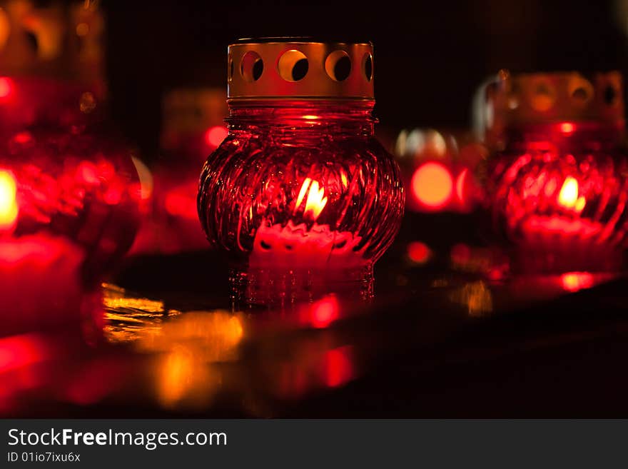 Red candle lights on dark background