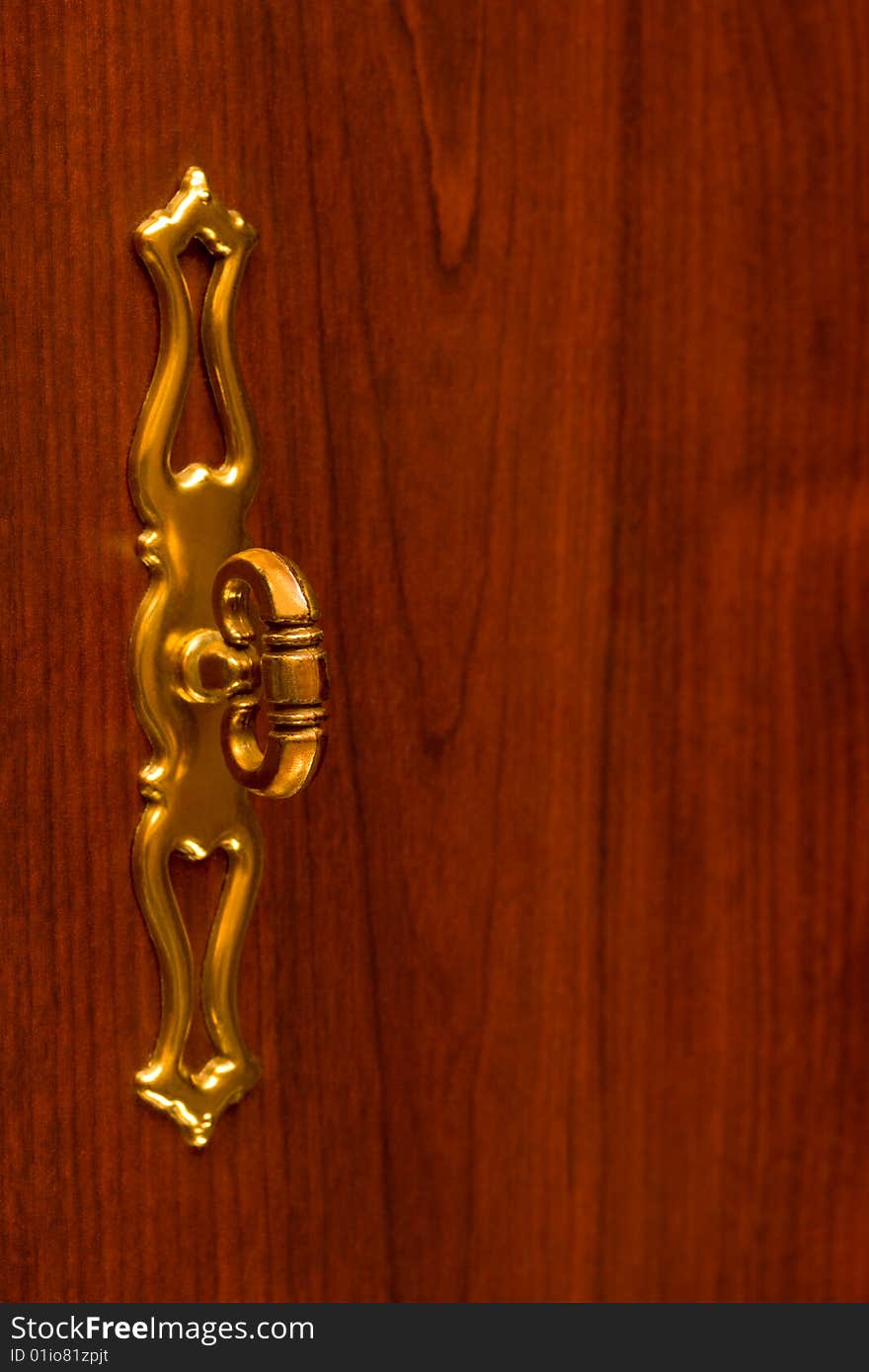 Retro gold handle on wooden door, abstract background. Retro gold handle on wooden door, abstract background