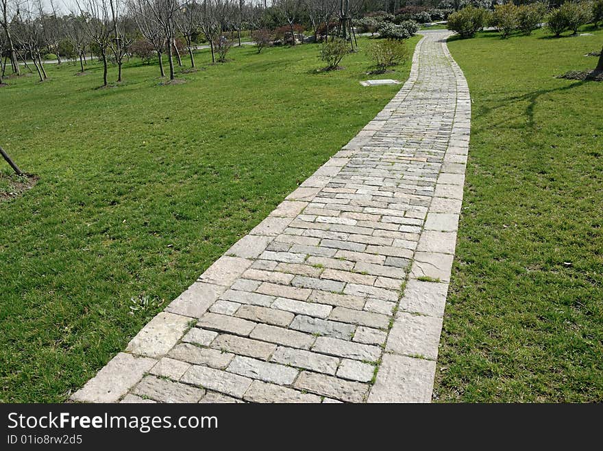 Garden stone path with grass. Garden stone path with grass