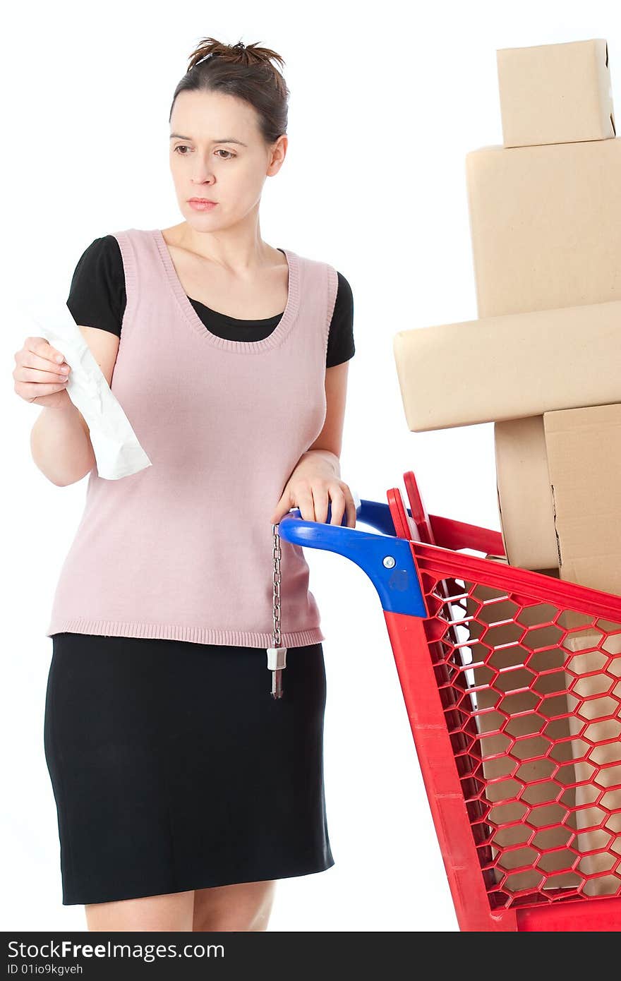 A woman checking her shopping receipt on white. A woman checking her shopping receipt on white