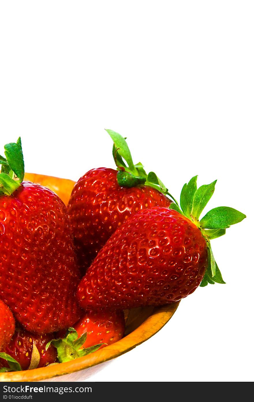 Several large and red sweet strawberries in bowl. isolated. half. Several large and red sweet strawberries in bowl. isolated. half.